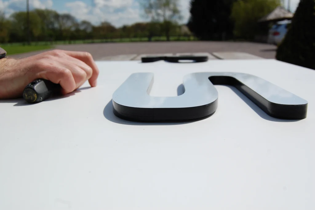 Marine-grade stainless steel yacht sign in production at Lumenautica's UK workshop